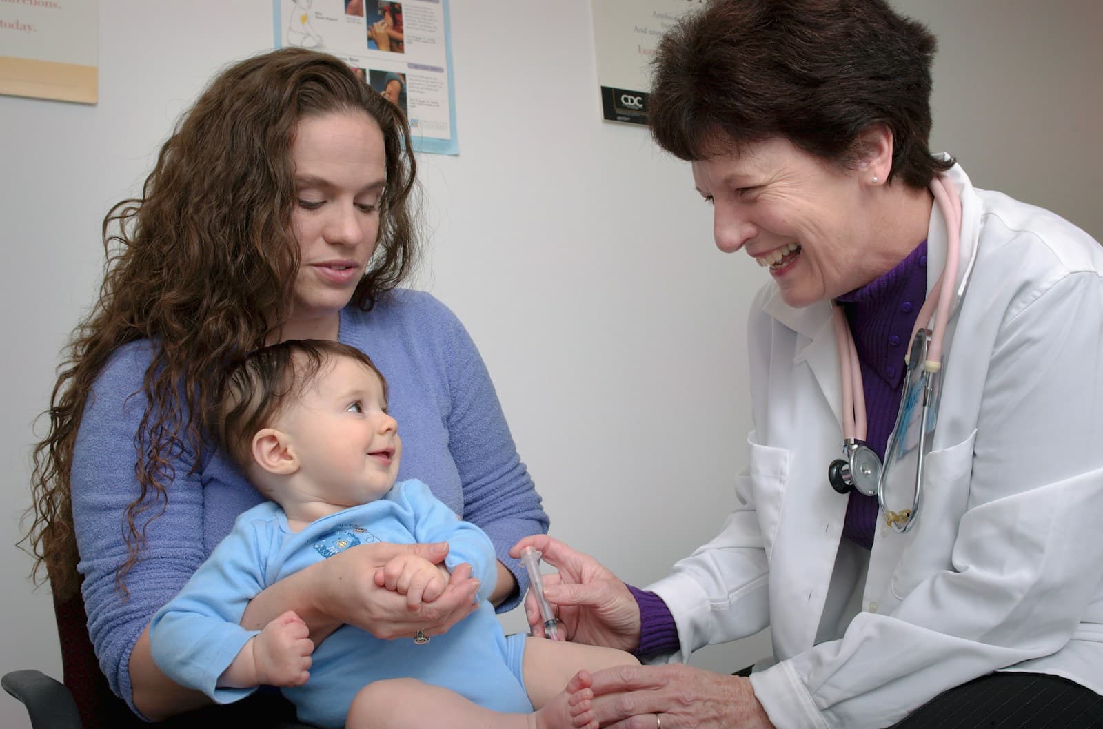 Family medicine physician meeting with a multigenerational family during an office visit