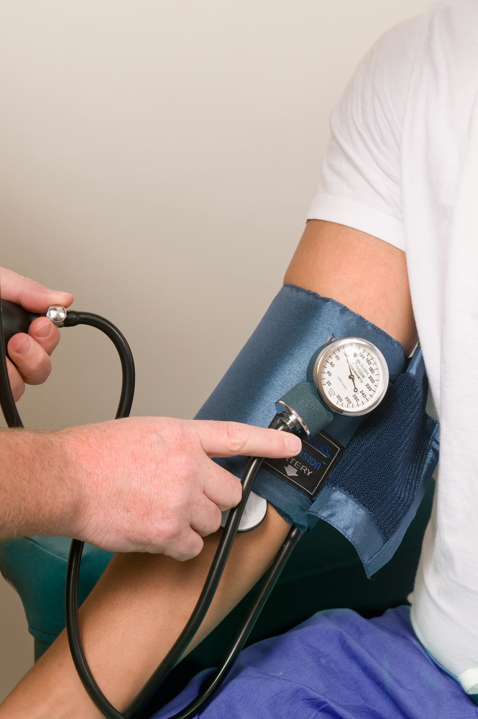 Internist reviewing a multi-condition care plan with a patient during a consultation